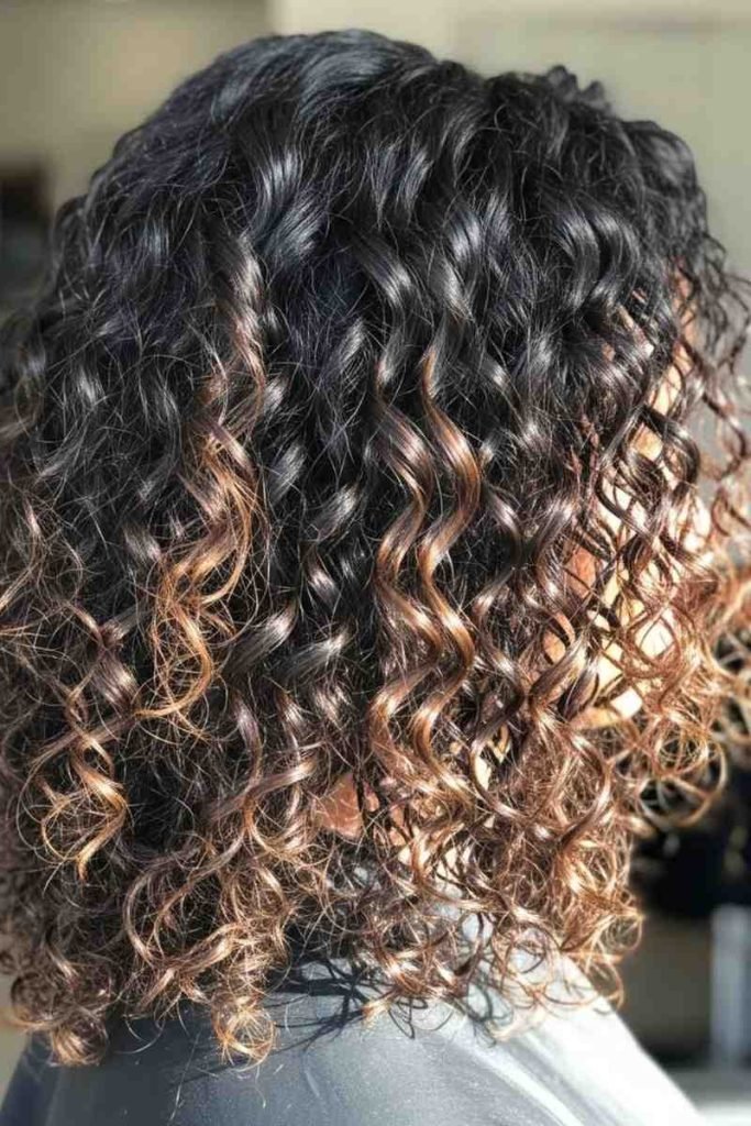 Warm Caramel Highlights on Dark Curls
